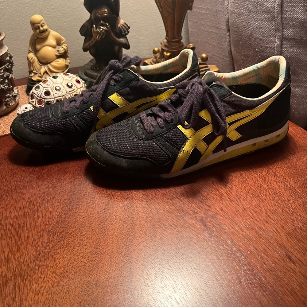 Le Tigre yellow and black trainers